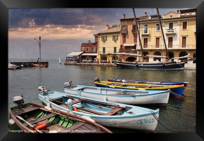 Serene Beauty: The Harbour at Malcesine Lake Garda Framed Print by Roger Mechan