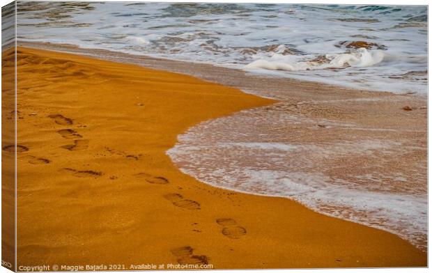 Sea and Red Sand with footsteps Canvas Print by Maggie Bajada