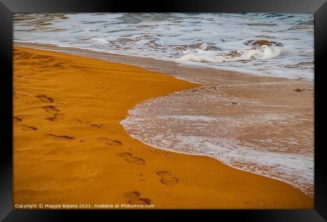 Sea and Red Sand with footsteps Framed Print by Maggie Bajada