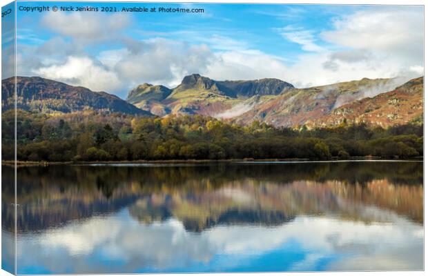 Langdale Pikes reflected in Elterwater Lake  Canvas Print by Nick Jenkins
