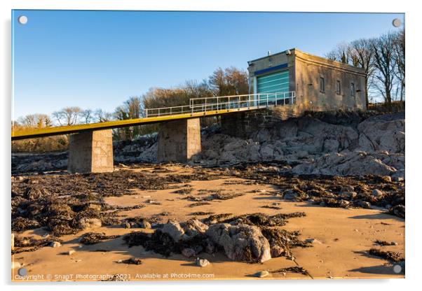 A coastal boat house and boat launch ramp slipway on a rocky beach in winter Acrylic by SnapT Photography