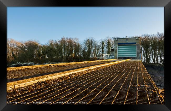 A close up of a boat house and boat launch slipway in winter Framed Print by SnapT Photography