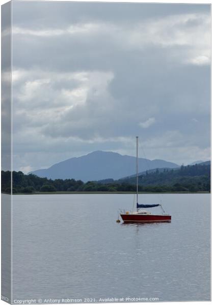 Little red sail boat moored on Loch Insh Canvas Print by Antony Robinson