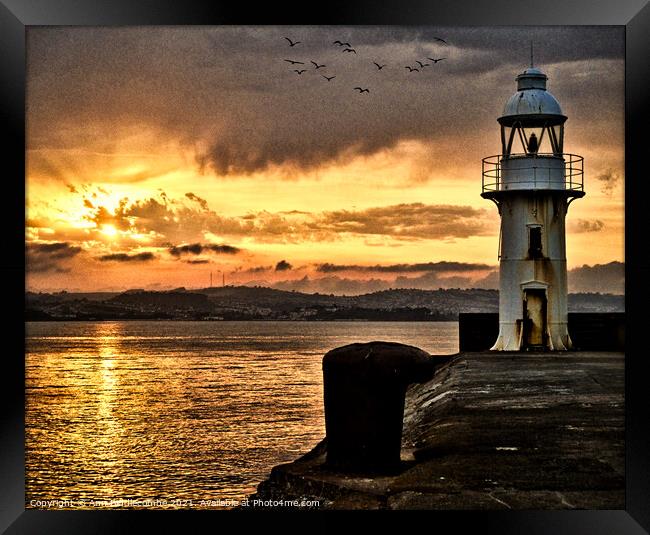 Dramatic sunset over Brixham Lighthouse Framed Print by Ann Biddlecombe