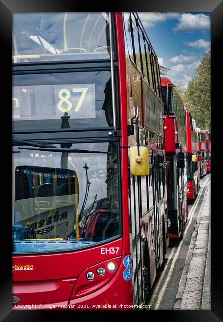Endless Stream of Iconic Red Buses Framed Print by Roger Mechan