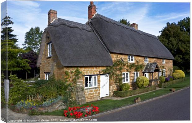 Thatched Cottage UK Canvas Print by Raymond Evans