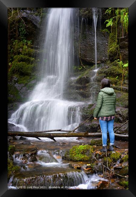 Woman traveler on a waterfall in Gondramaz, Portugal Framed Print by Luis Pina