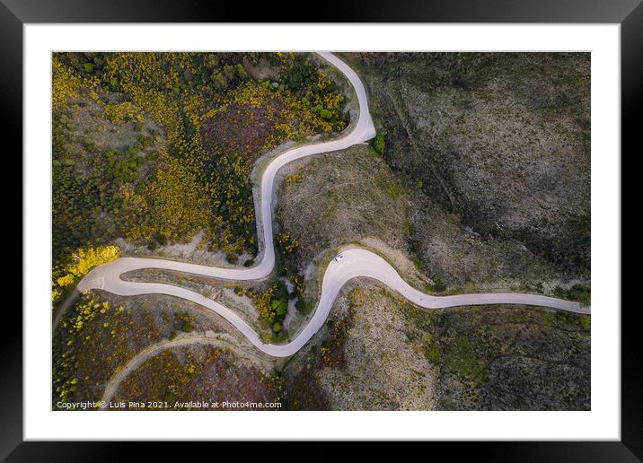 Beautiful drone aerial top view of road with curves in mountain landscape with a van social distancing near Piodao, Serra da Estrela in Portugal Framed Mounted Print by Luis Pina