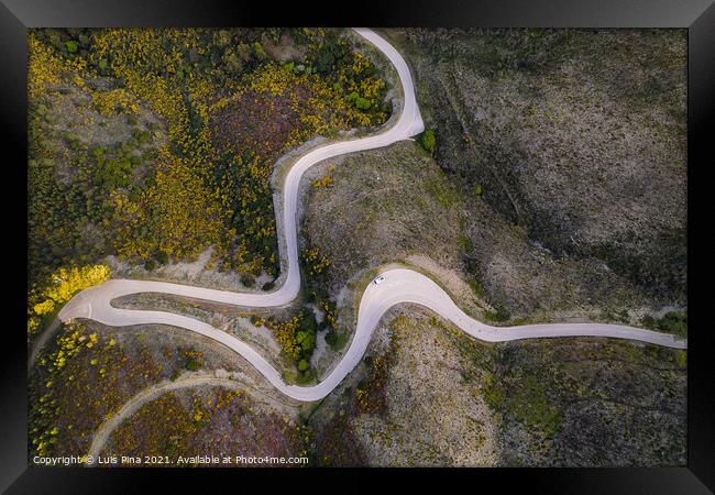 Beautiful drone aerial top view of road with curves in mountain landscape with a van social distancing near Piodao, Serra da Estrela in Portugal Framed Print by Luis Pina