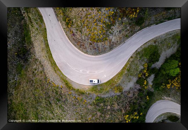Beautiful drone aerial top view of road with curves in mountain landscape with a van social distancing near Piodao, Serra da Estrela in Portugal Framed Print by Luis Pina