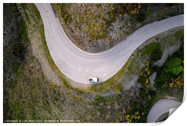 Beautiful drone aerial top view of road with curves in mountain landscape with a van social distancing near Piodao, Serra da Estrela in Portugal Print by Luis Pina
