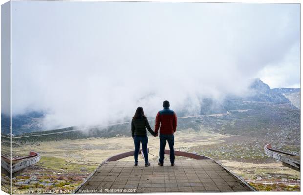 Couple holding hands on an abandoned cableway platform building social distancing beautiful landscape in Serra da Estrela, Portugal Canvas Print by Luis Pina