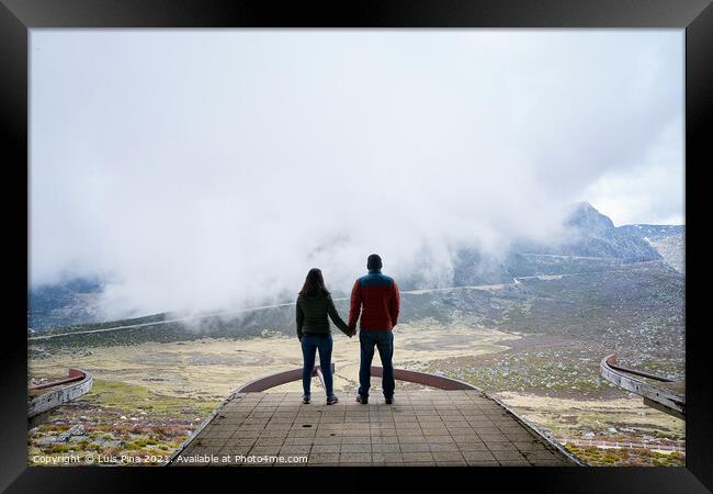 Couple holding hands on an abandoned cableway platform building social distancing beautiful landscape in Serra da Estrela, Portugal Framed Print by Luis Pina