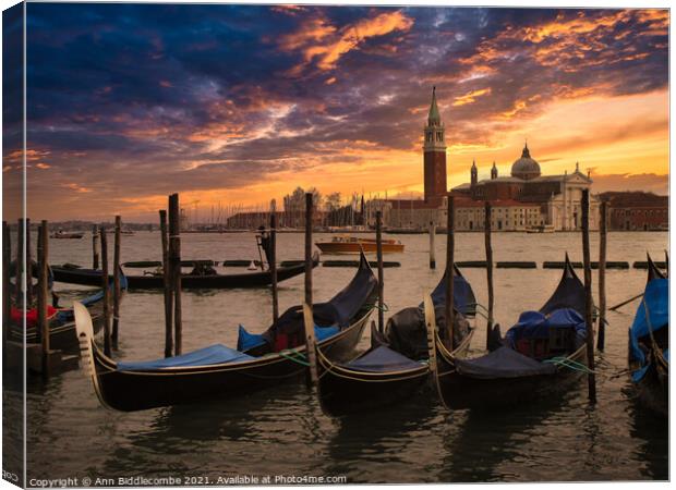 Gondolas at sunset on the main lagoon Canvas Print by Ann Biddlecombe