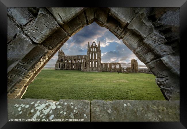 Saint Hildas Abbey Whitby seen through a ruined Gothic arch. Framed Print by Chris North