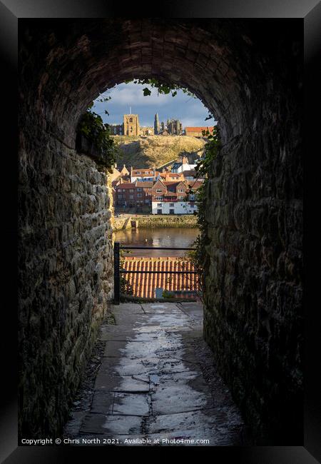Whitby through the alleyway arch. Framed Print by Chris North