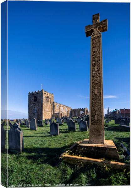 Celtic cross and Saint Hilda's Abbey Whitby. Canvas Print by Chris North