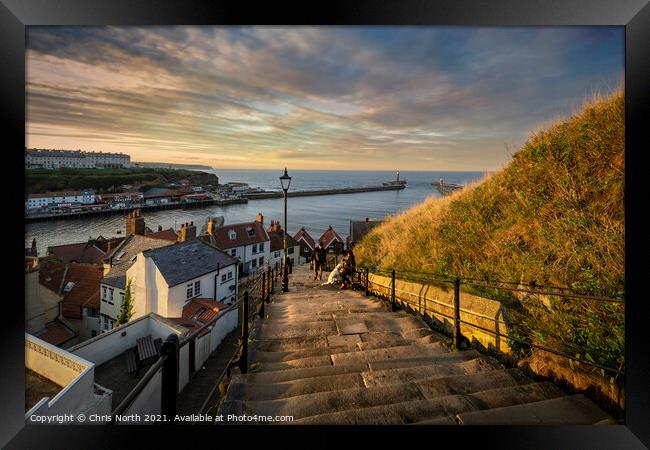 Whitby Harbour sunset scene from the 199 steps. Framed Print by Chris North