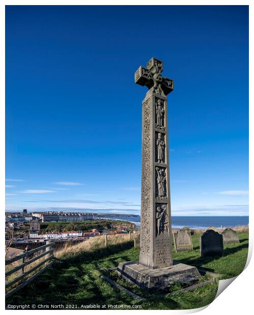 Celtic cross overlooking the seaside town of Whitby. Print by Chris North