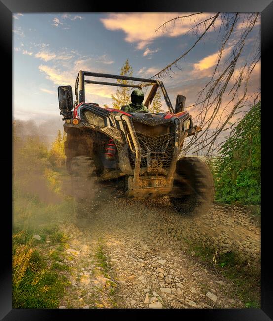4x4 off-road corridors designed metal utility terrain vehicle car or truck drive by a driver with helmet during passing mud part of special section off road track. Dirt race concept Framed Print by Arpan Bhatia