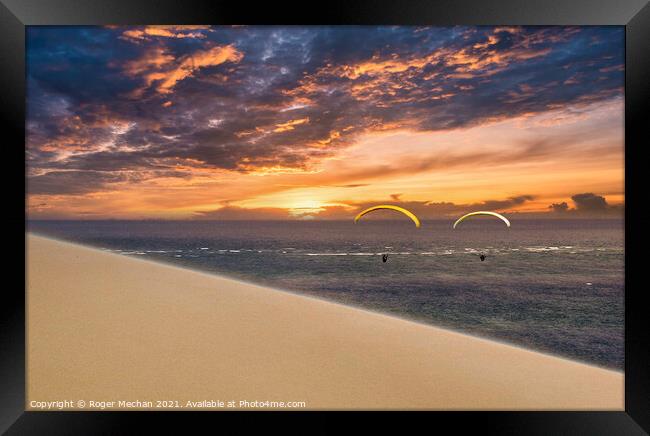 Soaring into the Golden Sunset Framed Print by Roger Mechan