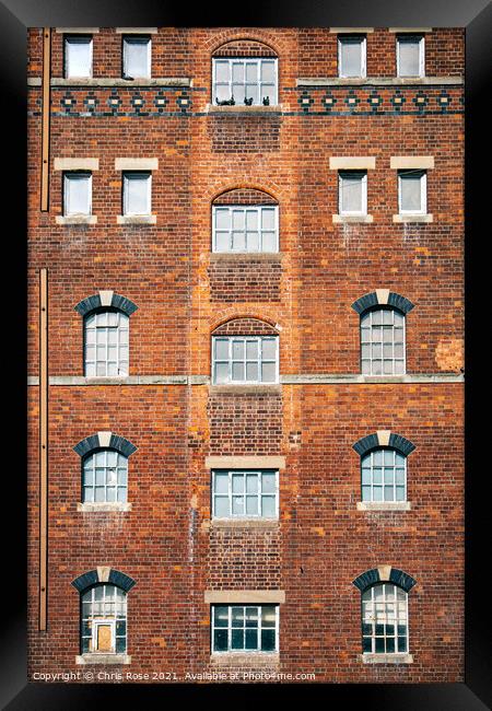 Brick wall and windows pattern Framed Print by Chris Rose