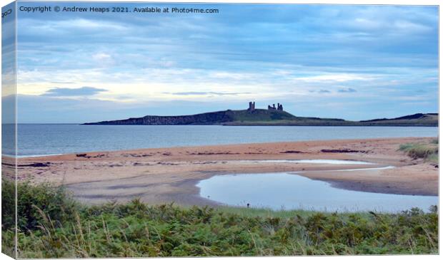 Dunstanburgh Castle viewed from beach. Canvas Print by Andrew Heaps