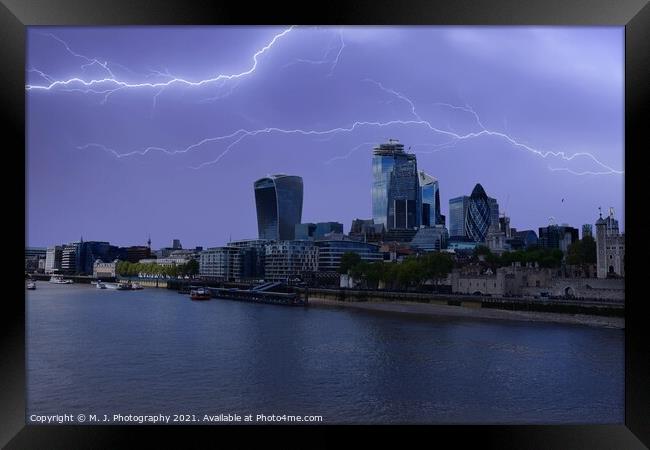 Lightning over the City of London and river Thames in England Framed Print by M. J. Photography