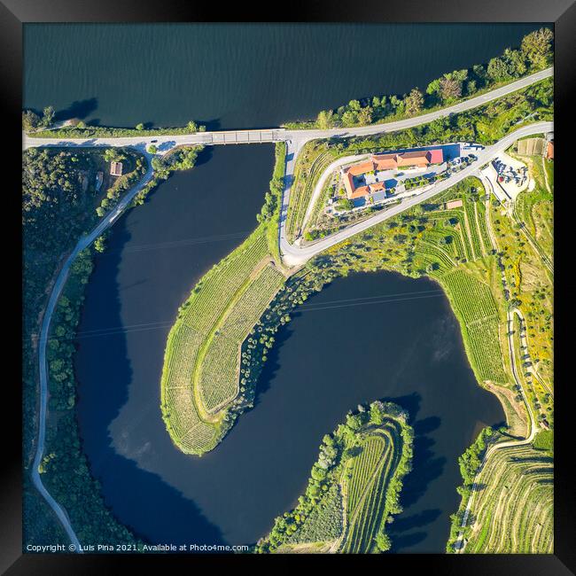 Douro wine valley region drone aerial top view of s shape bend river in Quinta do Tedo at sunset, in Portugal Framed Print by Luis Pina