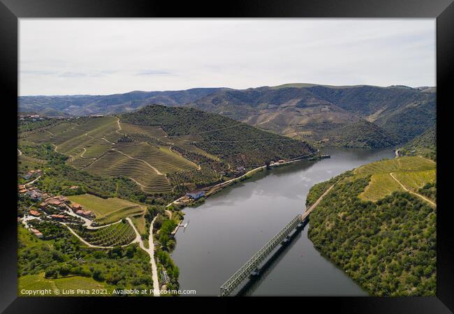 Douro railway bridge drone aerial view of river wine region in Ferradosa, Portugal Framed Print by Luis Pina