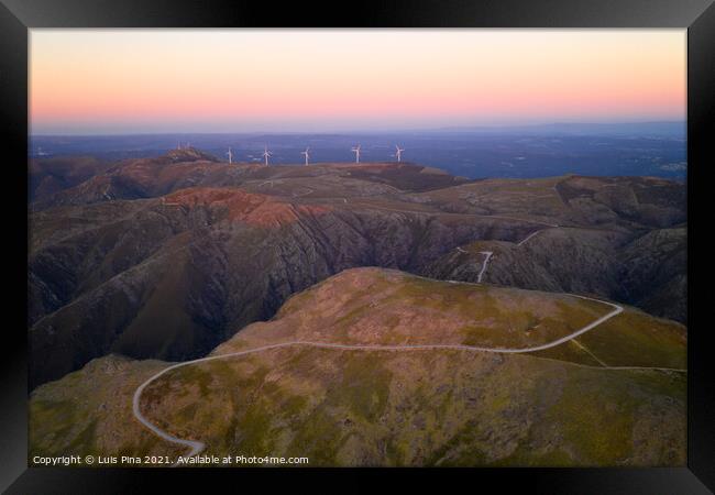 Serra da Freita drone aerial view in Arouca Geopark road with wind turbines at sunset, in Portugal Framed Print by Luis Pina
