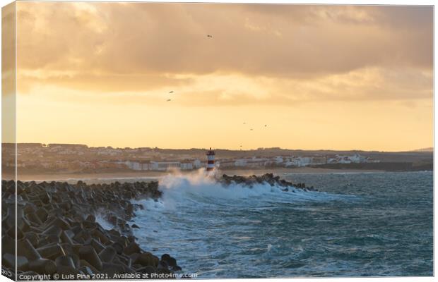 Peniche lighthouse with Supertubos beach on the background at sunset with waves crashing, in Portugal Canvas Print by Luis Pina