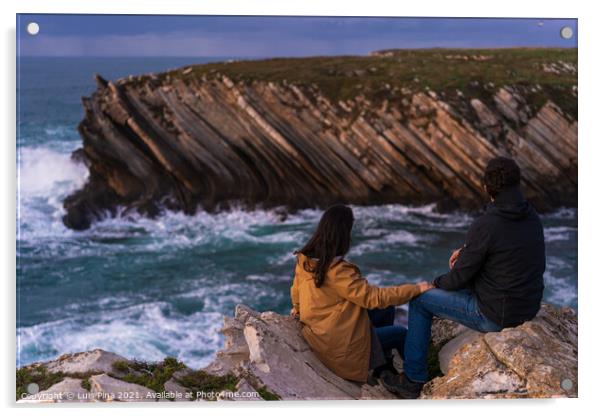 Couple caucasian female and male holding hands looking at cliff landscape with ocean waves in Baleal Island, Peniche, Portugal Acrylic by Luis Pina