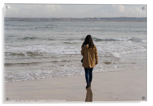 Woman walking on a beach with a yellow jacket in Peniche, Portugal Acrylic by Luis Pina