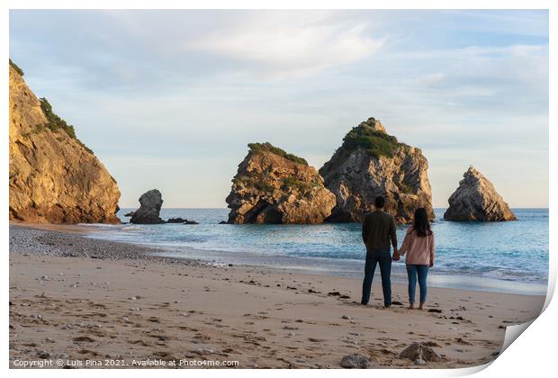 Couple holding hands on a wild empty beach in Ribeiro do Cavalo, Arrabida, Portugal Print by Luis Pina