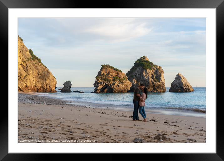 Couple kissing on a wild empty beach in Ribeiro do Cavalo, Arrabida, Portugal Framed Mounted Print by Luis Pina