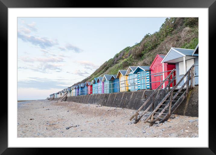 Beach huts line the promenade at Cromer Framed Mounted Print by Jason Wells