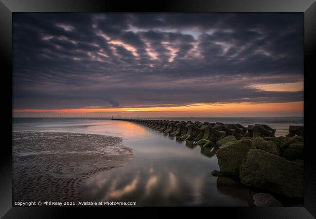 Breakwaters at the Wirral peninsular, at sunset Framed Print by Phil Reay