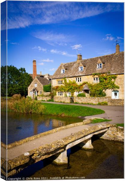 Lower Slaughter, idyllic riverside cottages Canvas Print by Chris Rose