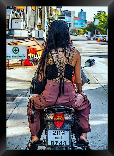 a young tattooed Thai woman on a motorcycle Framed Print by Wilfried Strang