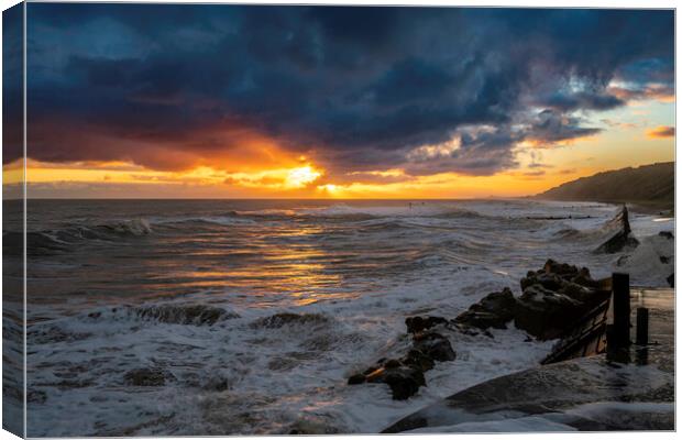 High tide sunrise on Mundesley seafront Canvas Print by Andrew Sharpe