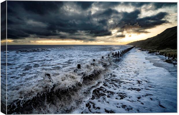 High tide sunrise on Mundesley seafront Canvas Print by Andrew Sharpe