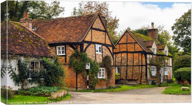 Period Cottages in English Village Canvas Print by Pearl Bucknall