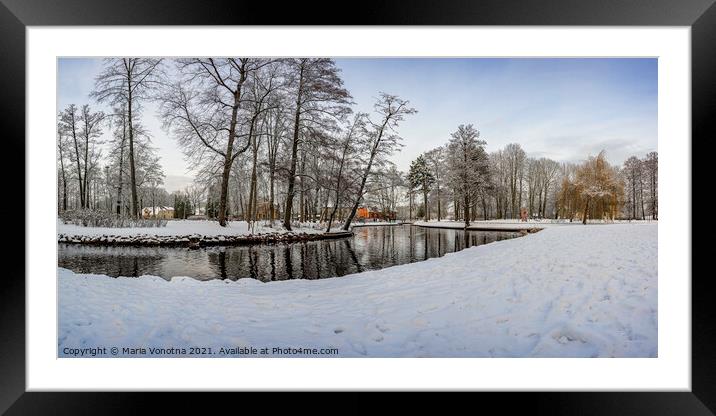 Winter landscape in snowy park with small pond Framed Mounted Print by Maria Vonotna
