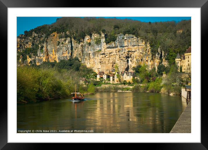 A sightseeing boat passes La Roque-Gageac Framed Mounted Print by Chris Rose