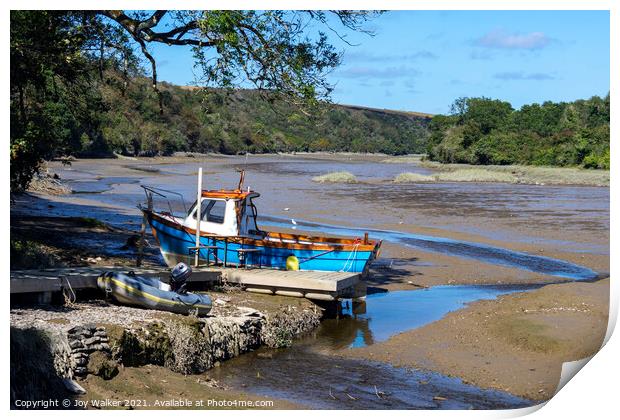 A small fishing boat moored while the tide is out Print by Joy Walker