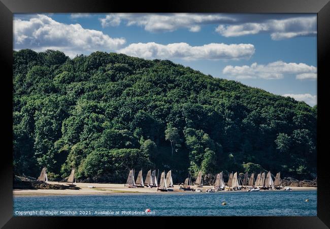 Serene Beach with Sailing Boats Framed Print by Roger Mechan