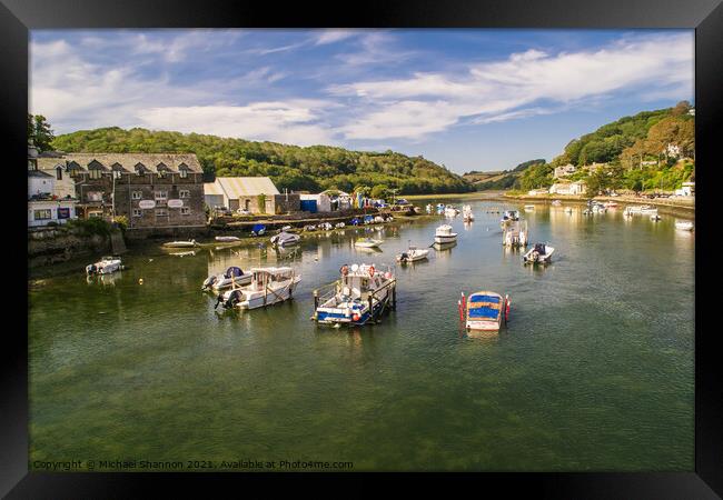Boats moored on the river estuary, Looe, Cornwall Framed Print by Michael Shannon