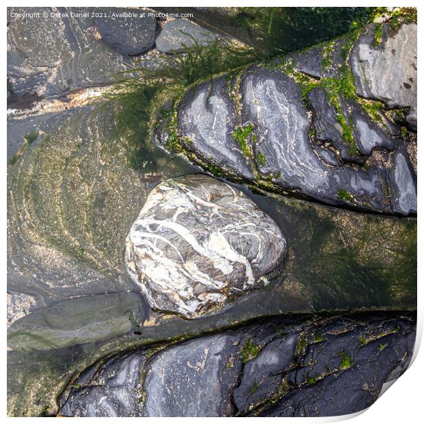Rocks on the beach at Crackington Haven, Cornwall Print by Derek Daniel