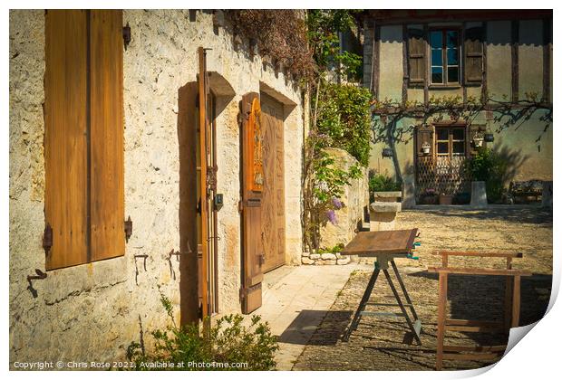 Pujols, traditional wooden shutters being repaired Print by Chris Rose